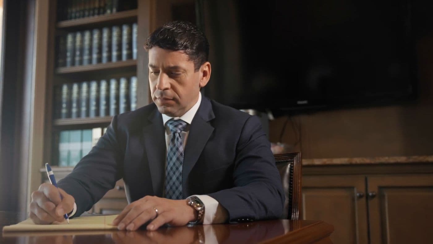 Chris Corzo reviewing a case file at his desk
